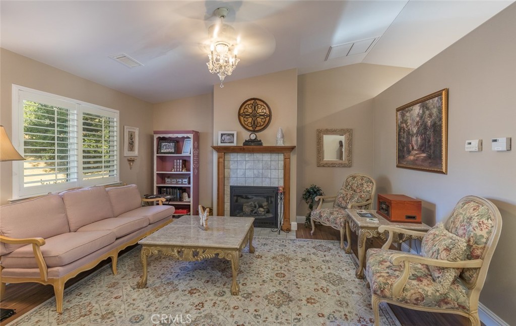 5060-5064 Mykleoaks Road Mariposa, CA 95338 - Photo 44 of 63 a living room with furniture a chandelier and a fireplace