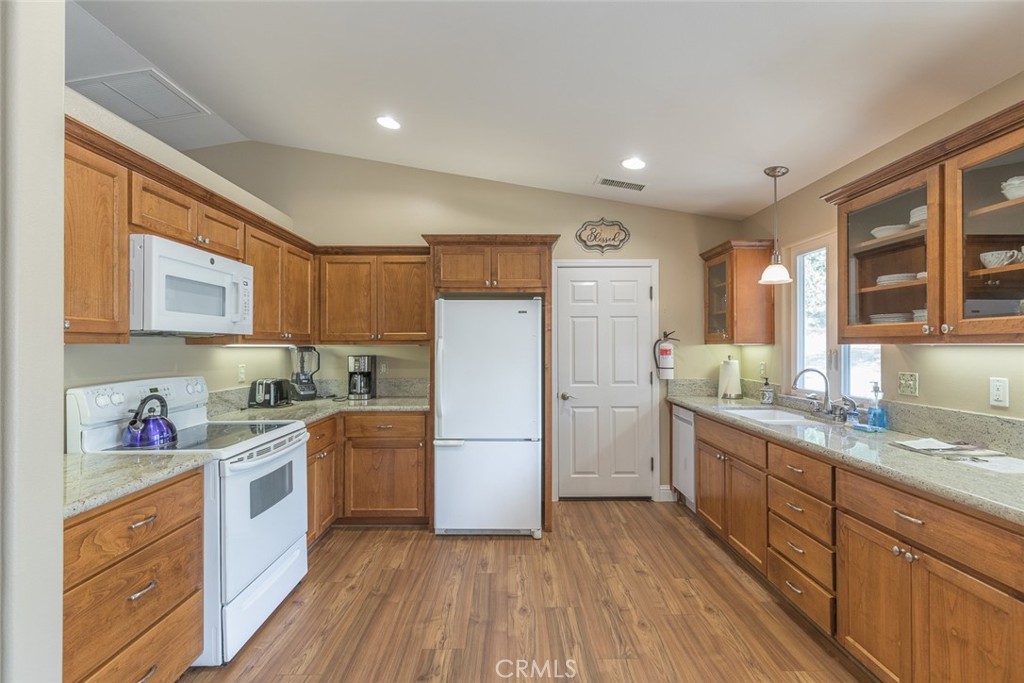 5060-5064 Mykleoaks Road Mariposa, CA 95338 - Photo 52 of 63 a kitchen with a sink wooden floor and stainless steel appliances