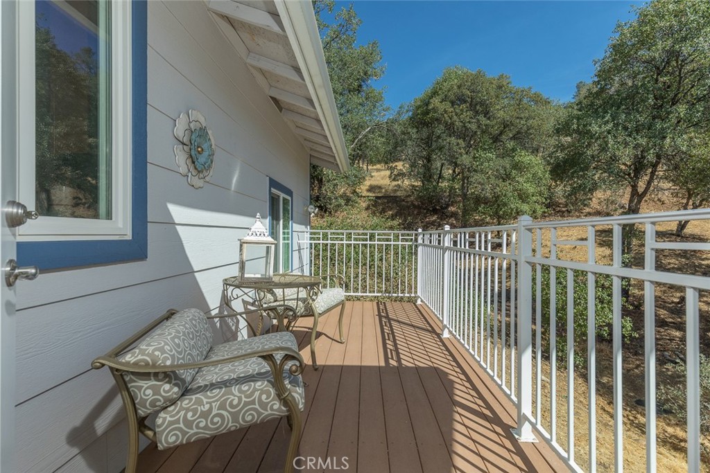 5060-5064 Mykleoaks Road Mariposa, CA 95338 - Photo 57 of 63 a view of a chair and table on the deck