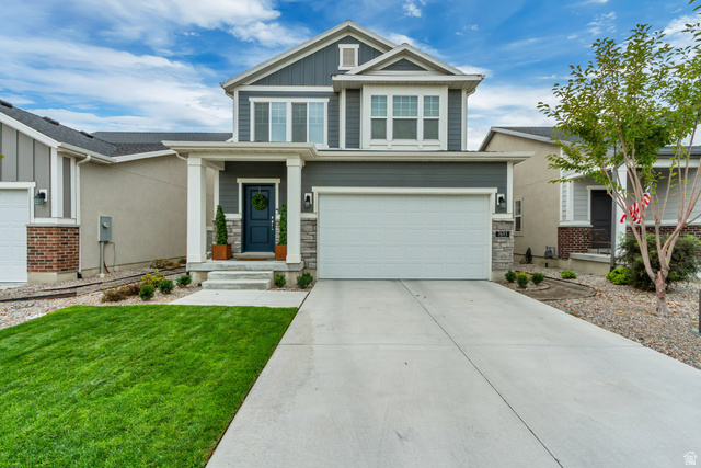 7693 West Mount Elinor Road Magna, UT 84044 - Photo 1 of 33 Two-story exterior with gray siding and stone accents