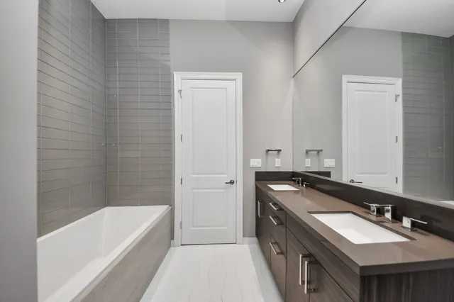 a bathroom with a bathtub and a sink