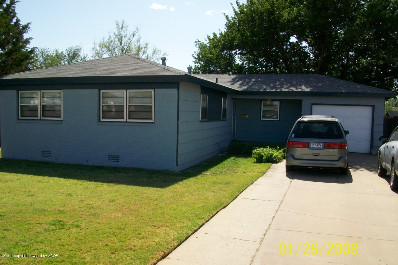 a house view with a garden space