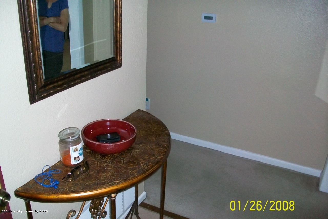 4412 South Bonham Street Amarillo, TX 79110 - Photo 14 of 26 a bathroom with a sink a mirror and toilet