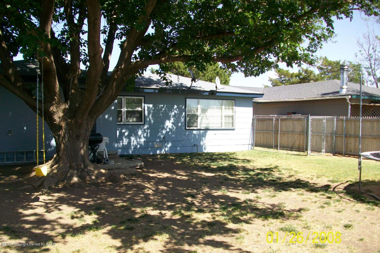4412 South Bonham Street Amarillo, TX 79110 - Photo 6 of 26 a front view of a house with a tree