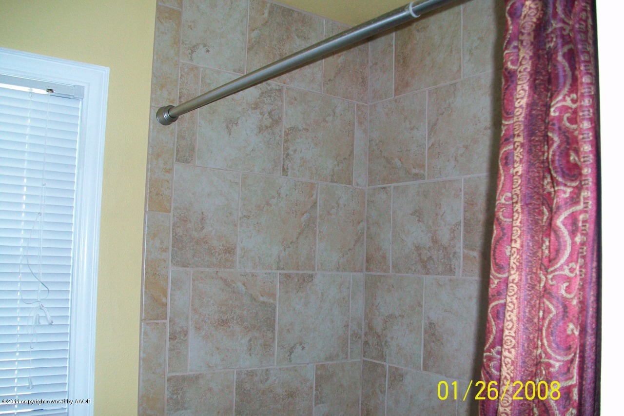 4412 South Bonham Street Amarillo, TX 79110 - Photo 7 of 26 a bathroom with a shower