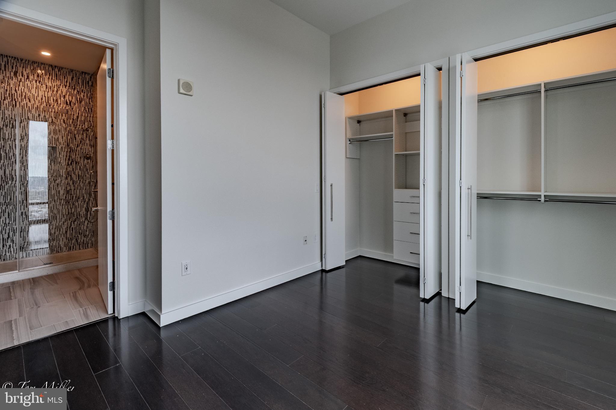 414 Light Street, Unit 4302 Baltimore, MD 21202 - Photo 14 of 42 an empty room with wooden floor and closet