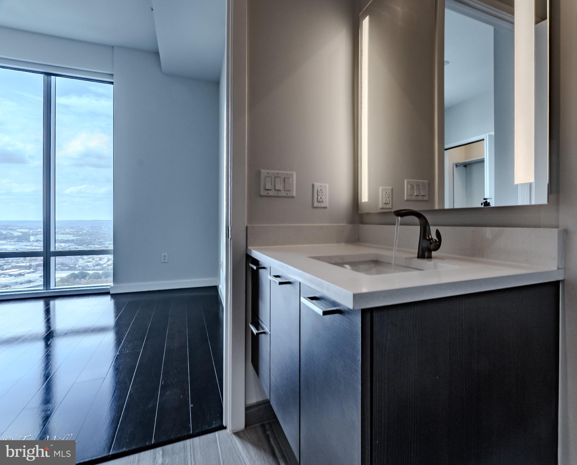 414 Light Street, Unit 4302 Baltimore, MD 21202 - Photo 24 of 42 a view of bathroom with sink and mirror