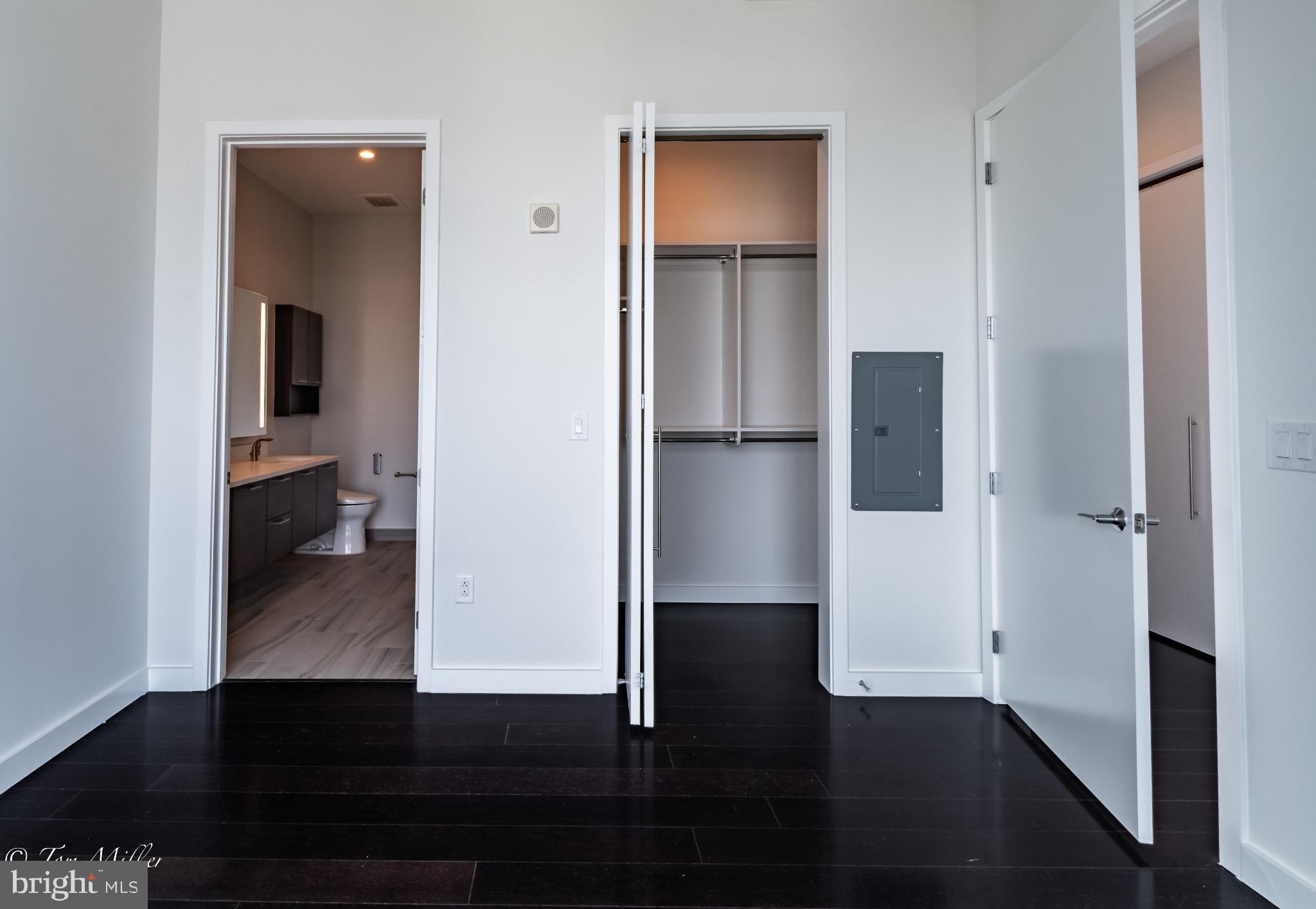 414 Light Street, Unit 4302 Baltimore, MD 21202 - Photo 28 of 42 a view of hallway with wooden floor and cabinets
