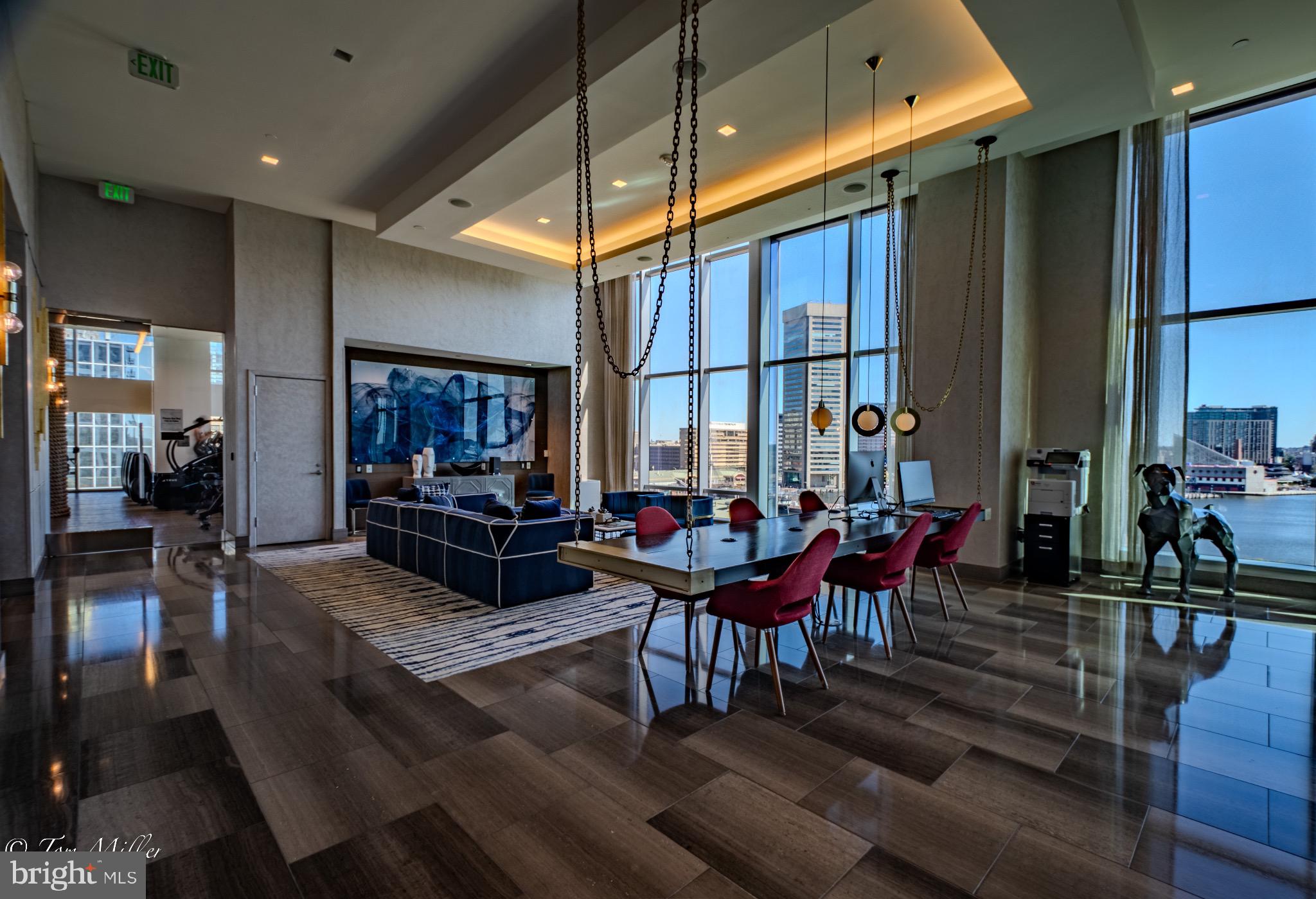 414 Light Street, Unit 4302 Baltimore, MD 21202 - Photo 34 of 42 a living room with furniture a table and chairs
