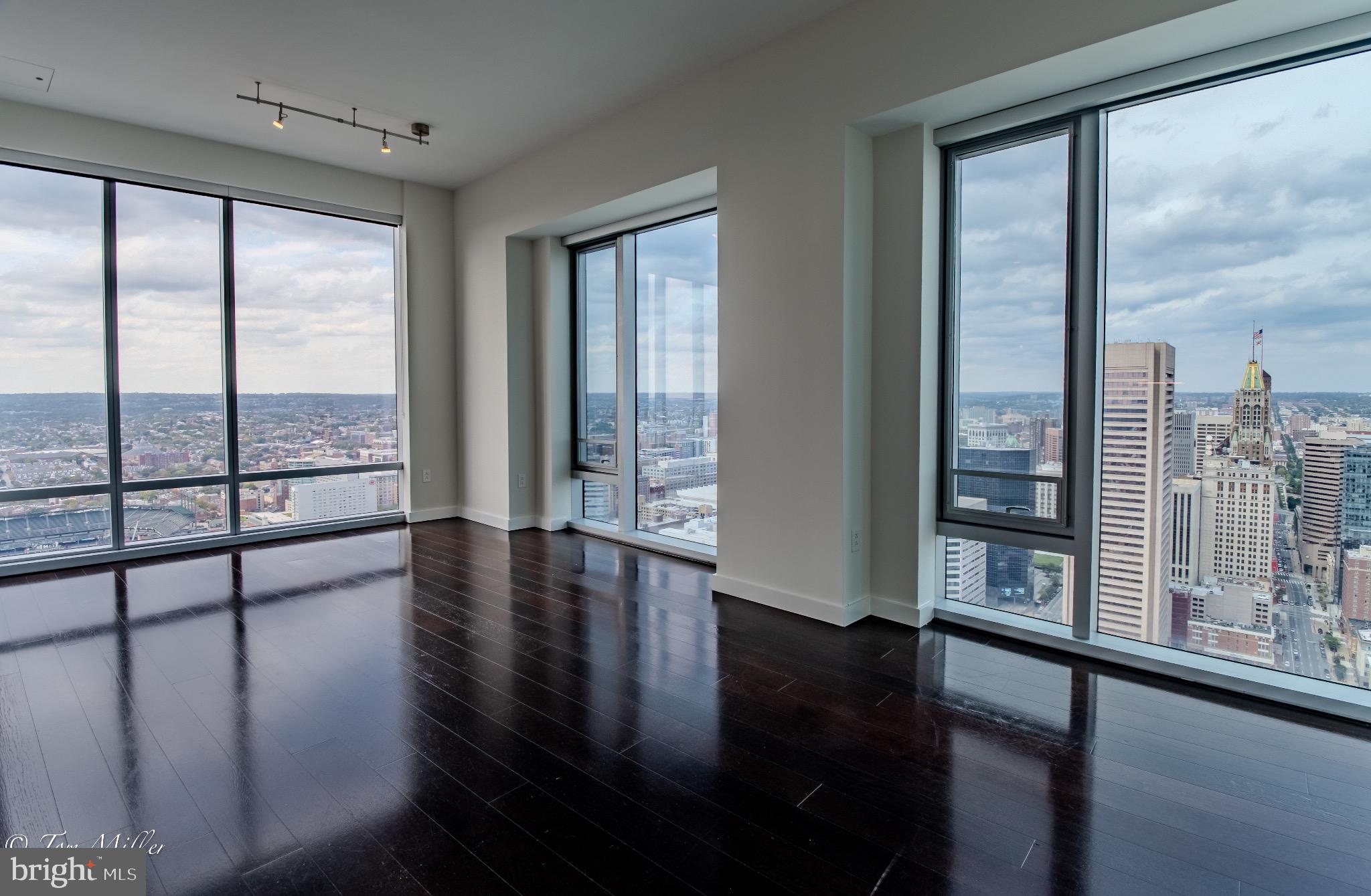 414 Light Street, Unit 4302 Baltimore, MD 21202 - Photo 6 of 42 a view of an entryway with wooden floor and windows