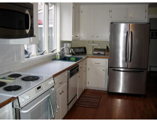 47 Crown Ridge Road Wellesley, MA 02482 - Photo 6 of 11 a kitchen with stainless steel appliances a refrigerator a stove a sink and a microwave