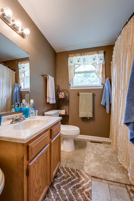 120 Mae Circle Dickson, TN 37055 - Photo 11 of 19 a bathroom with a sink toilet and window