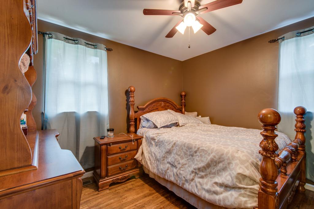 120 Mae Circle Dickson, TN 37055 - Photo 12 of 19 a bedroom with a bed and a chandelier
