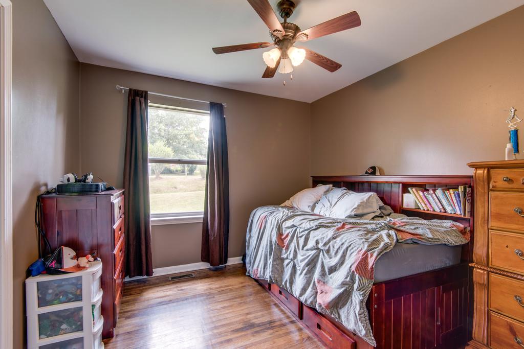 120 Mae Circle Dickson, TN 37055 - Photo 15 of 19 a bedroom with a bed and a window