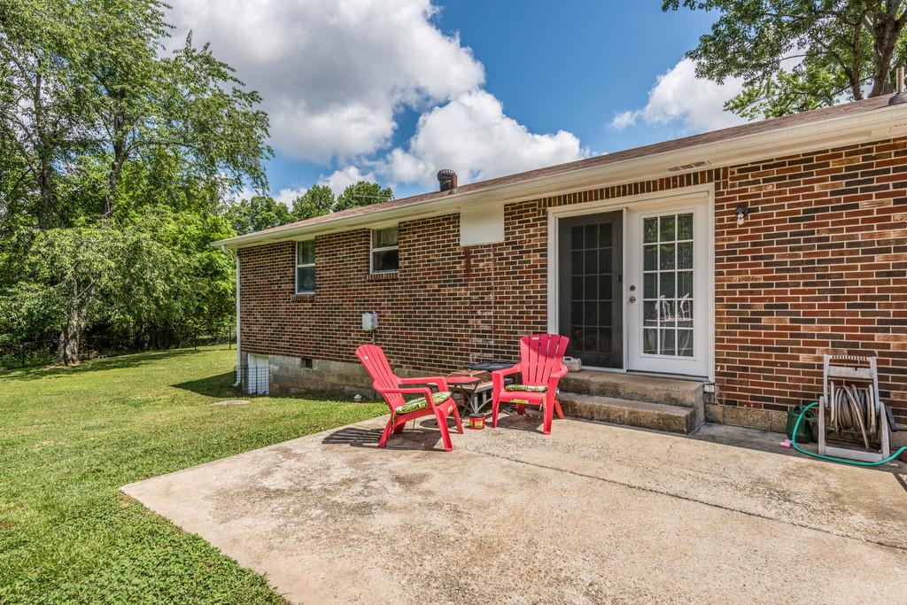 120 Mae Circle Dickson, TN 37055 - Photo 18 of 19 a backyard of a house with table and chairs