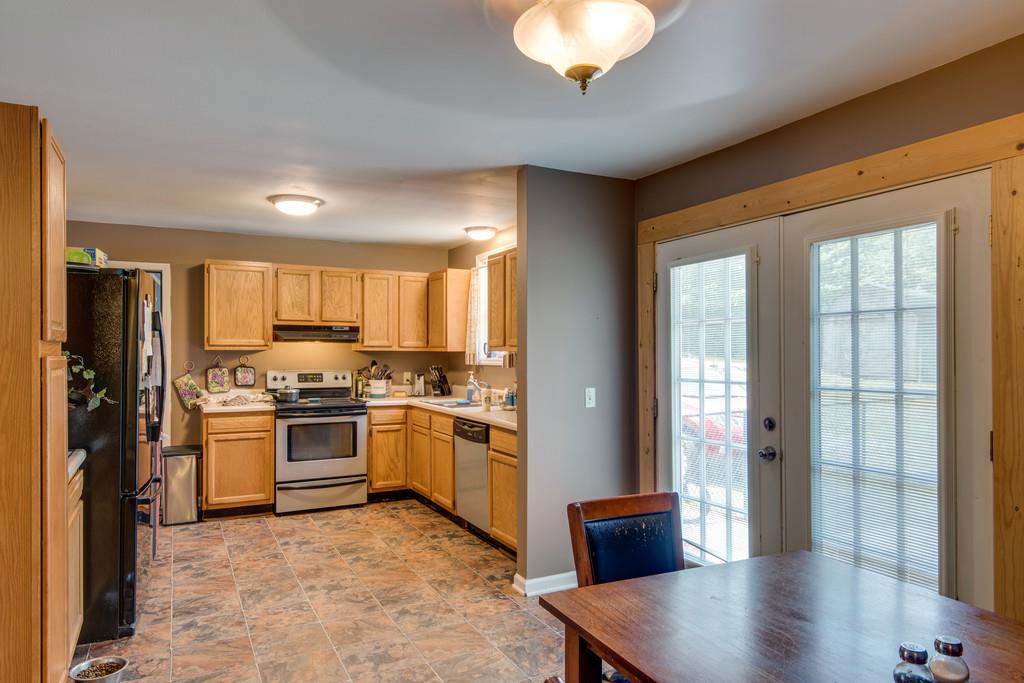 120 Mae Circle Dickson, TN 37055 - Photo 7 of 19 a kitchen with cabinets and stainless steel appliances