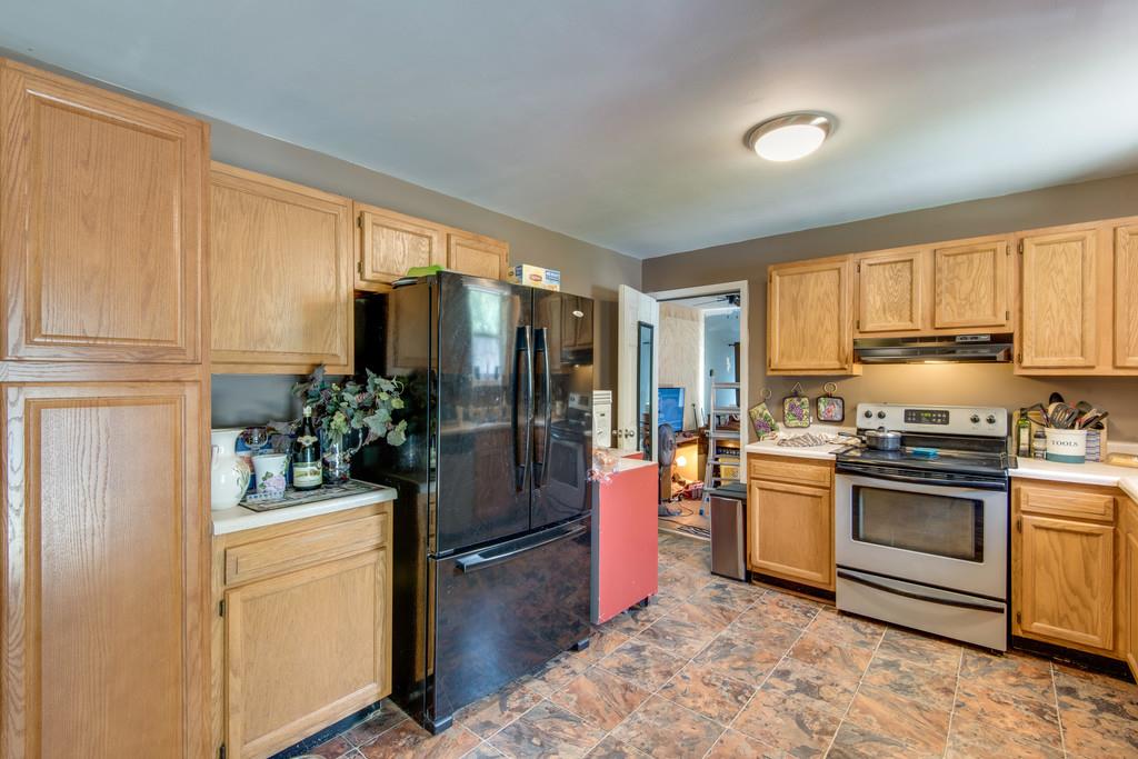 120 Mae Circle Dickson, TN 37055 - Photo 8 of 19 a kitchen with a refrigerator stove and sink