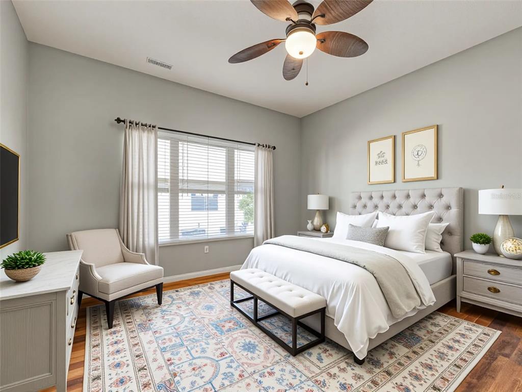 1801 Highland Road Osprey, FL 34229 - Photo 18 of 40 a spacious bedroom with a bed and a chandelier