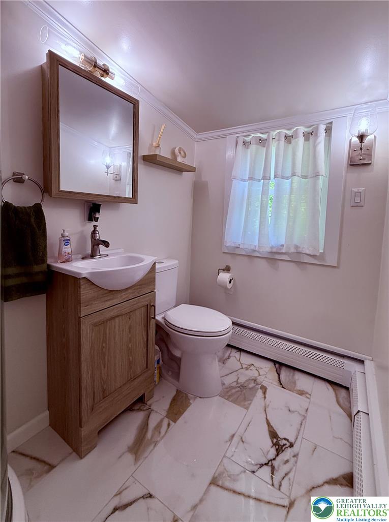 1275 Macada Road Bethlehem, PA 18017 - Photo 44 of 87 A well-appointed bathroom features crown molding and stylish tile flooring.