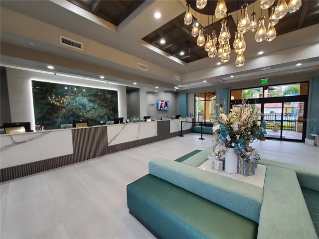 a view of a living room and livingroom with furniture wooden floor and a large window