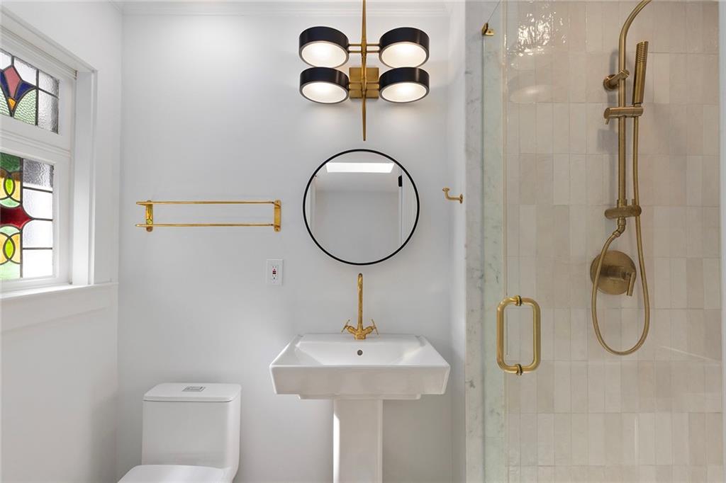1275 The By Way Northeast Atlanta, GA 30306 - Photo 23 of 48 a bathroom with a sink mirror and toilet