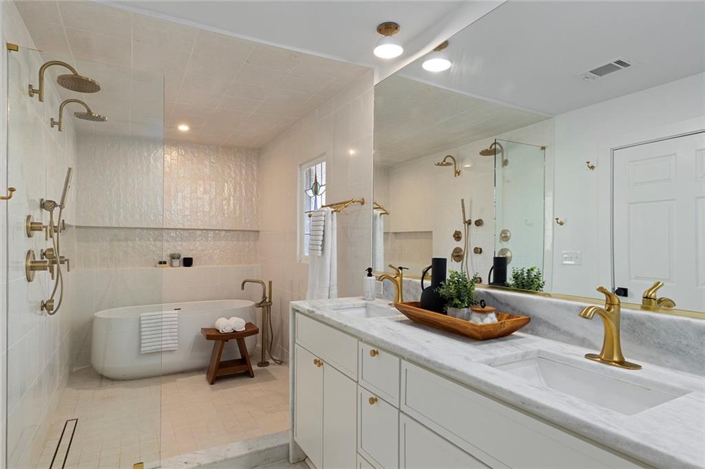 1275 The By Way Northeast Atlanta, GA 30306 - Photo 28 of 48 a bathroom with a tub sink and a mirror