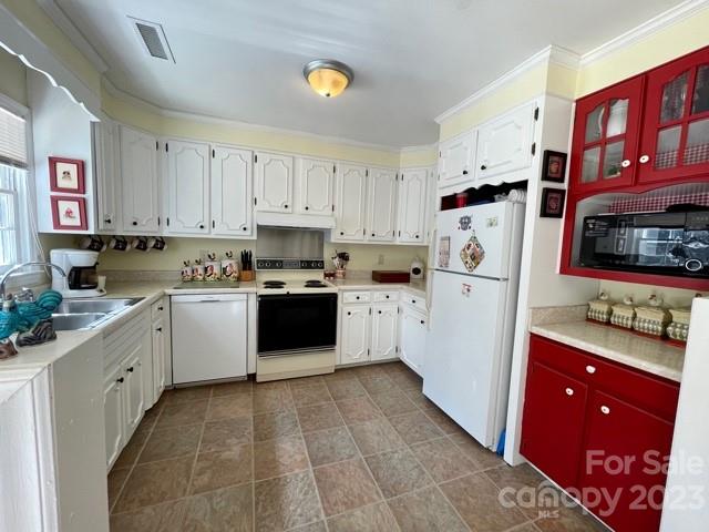 3790 John Watson Road Tryon, NC 28782 - Photo 3 of 44 a kitchen with white cabinets and white appliances