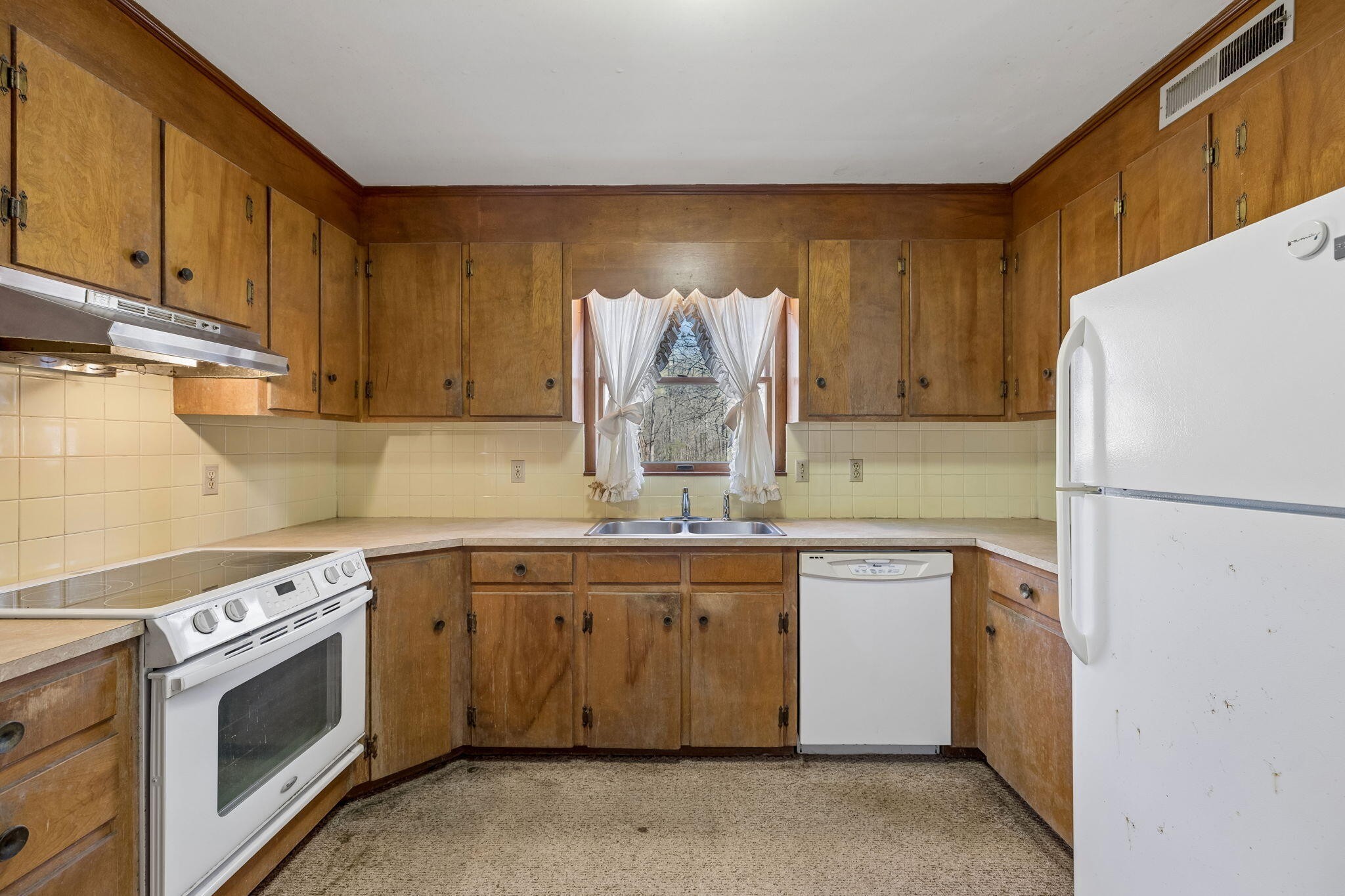 766 Bowling Alley Road Manchester, TN 37355 - Photo 15 of 57 a kitchen with a sink a stove and cabinets