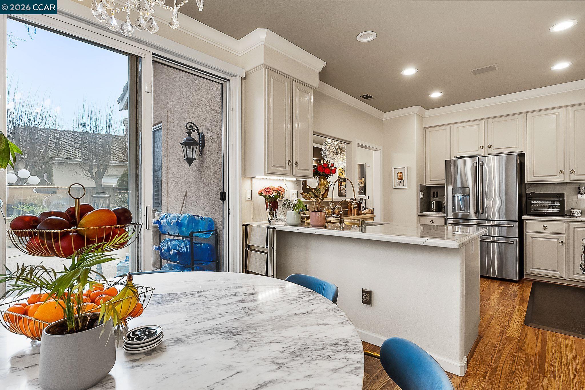 3607 Crystal Tree Court Stockton, CA 95219 - Photo 11 of 44 a kitchen with stainless steel appliances a sink stove and refrigerator