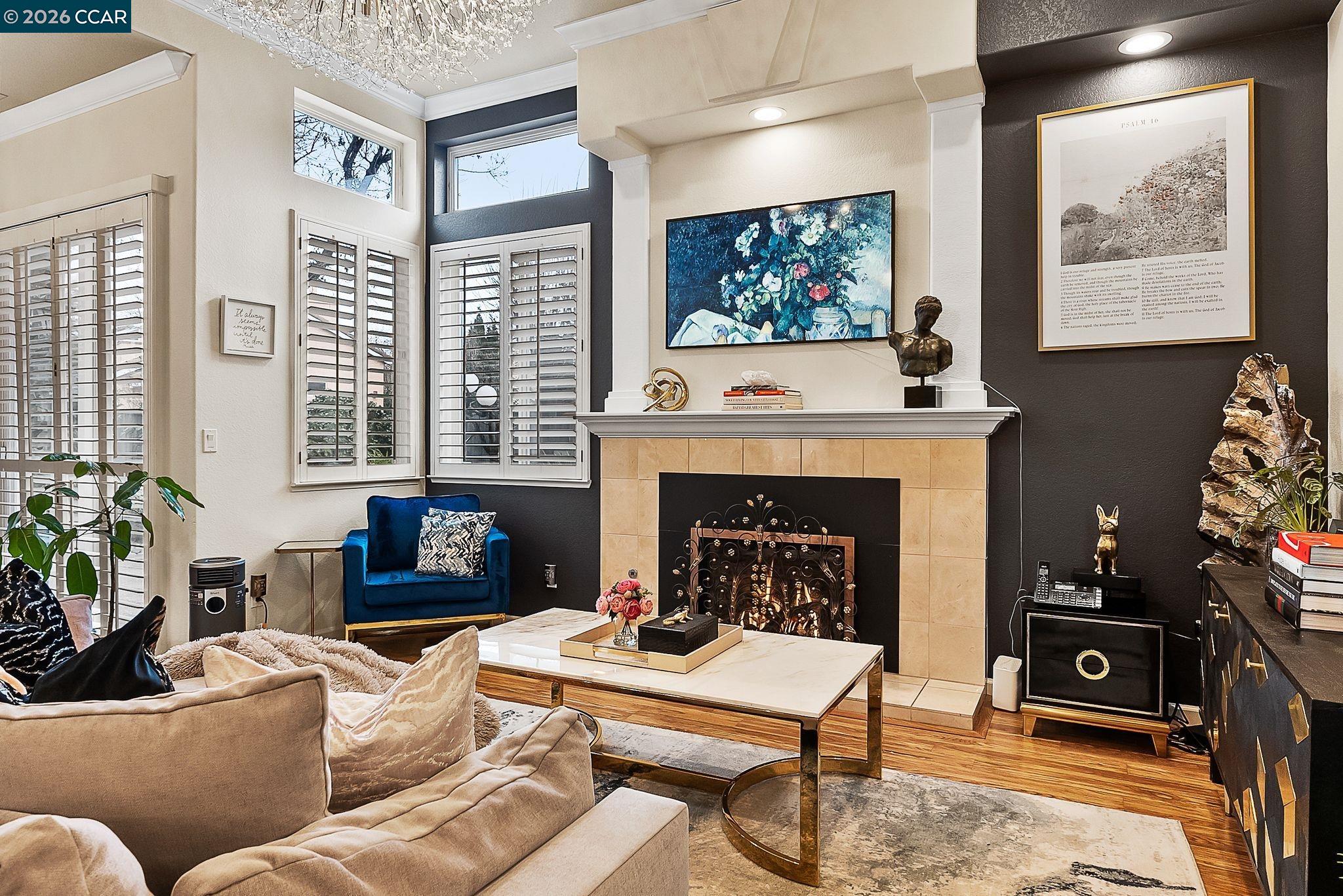 3607 Crystal Tree Court Stockton, CA 95219 - Photo 17 of 44 a living room with furniture a flat screen tv and a fireplace