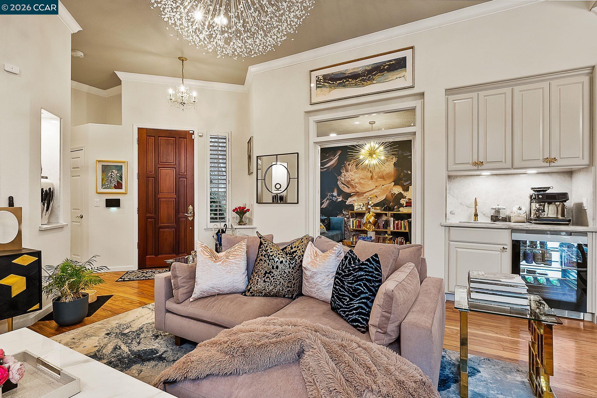 3607 Crystal Tree Court Stockton, CA 95219 - Photo 20 of 44 a living room with furniture and a chandelier