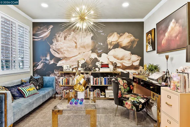 a living room with lots of furniture and a chandelier