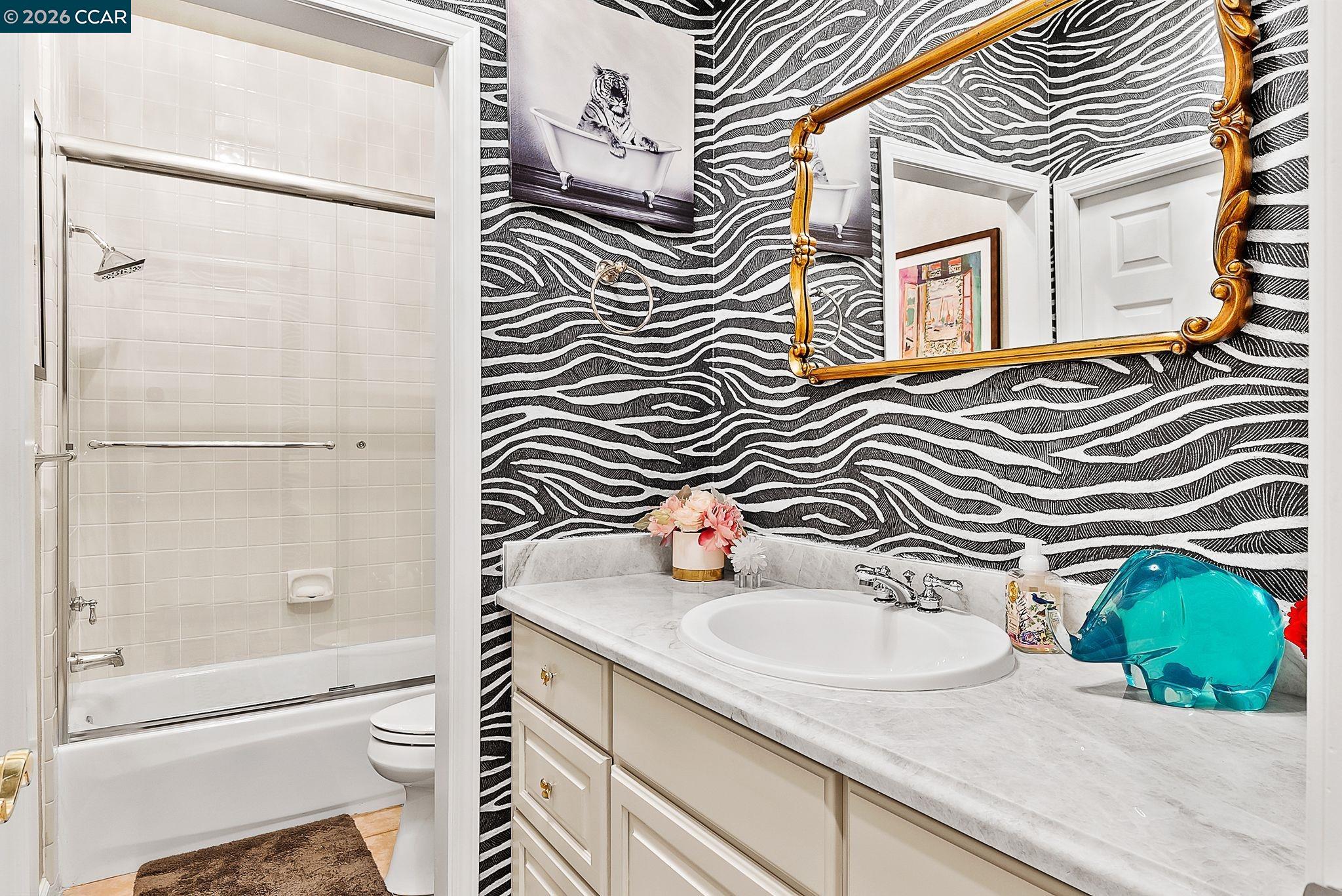 3607 Crystal Tree Court Stockton, CA 95219 - Photo 25 of 44 a bathroom with a sink toilet and shower