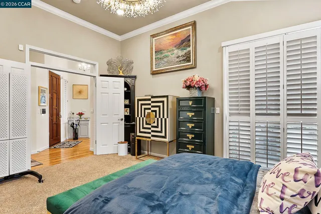 a bedroom with furniture and a window