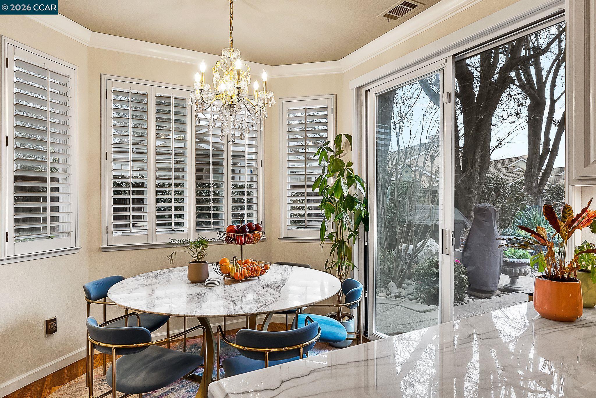 3607 Crystal Tree Court Stockton, CA 95219 - Photo 8 of 44 a view of a dining room with furniture and a potted plant