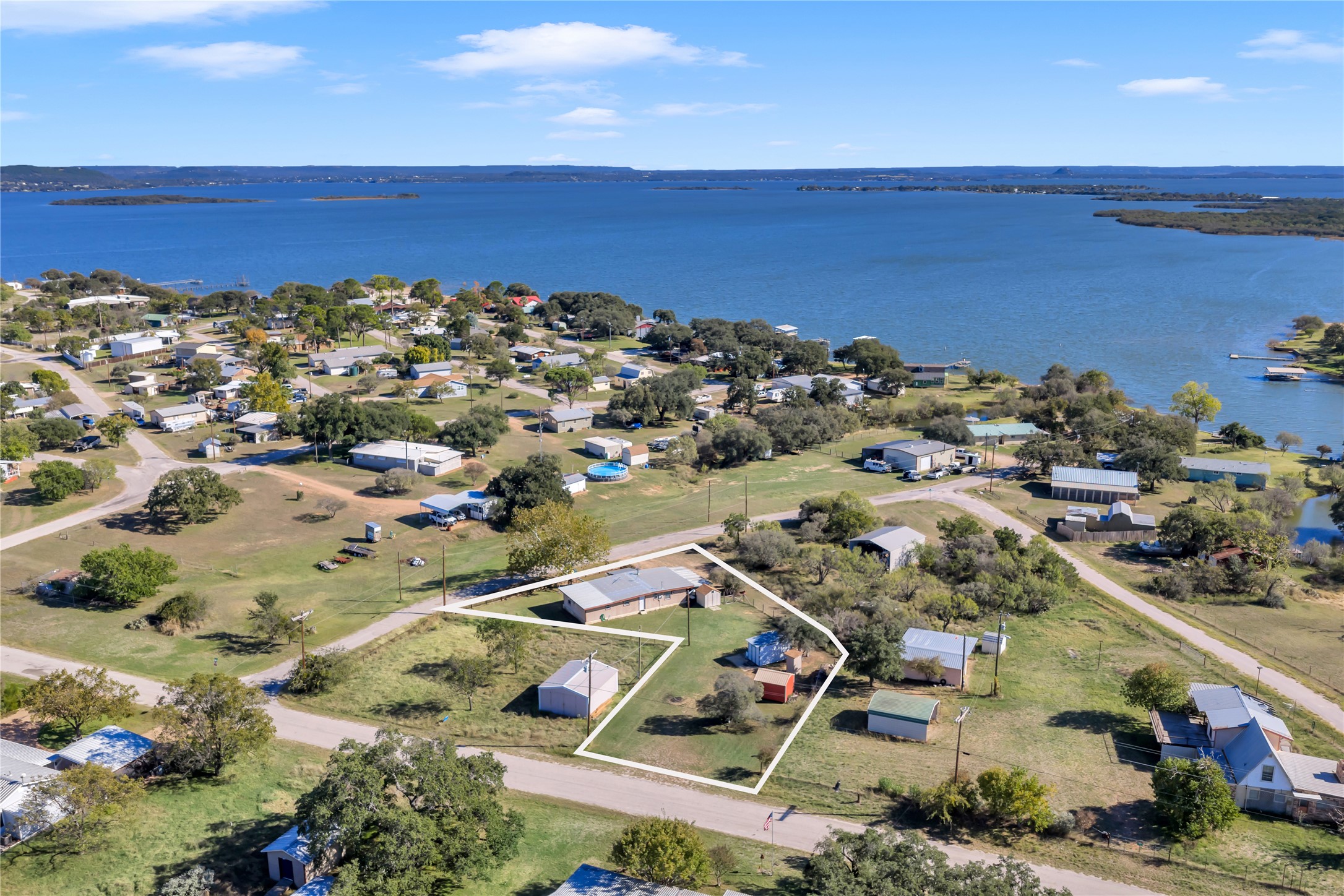 1415 Bee Lane Tow, TX 78672 - Photo 1 of 39 an aerial view of ocean and residential houses with outdoor space