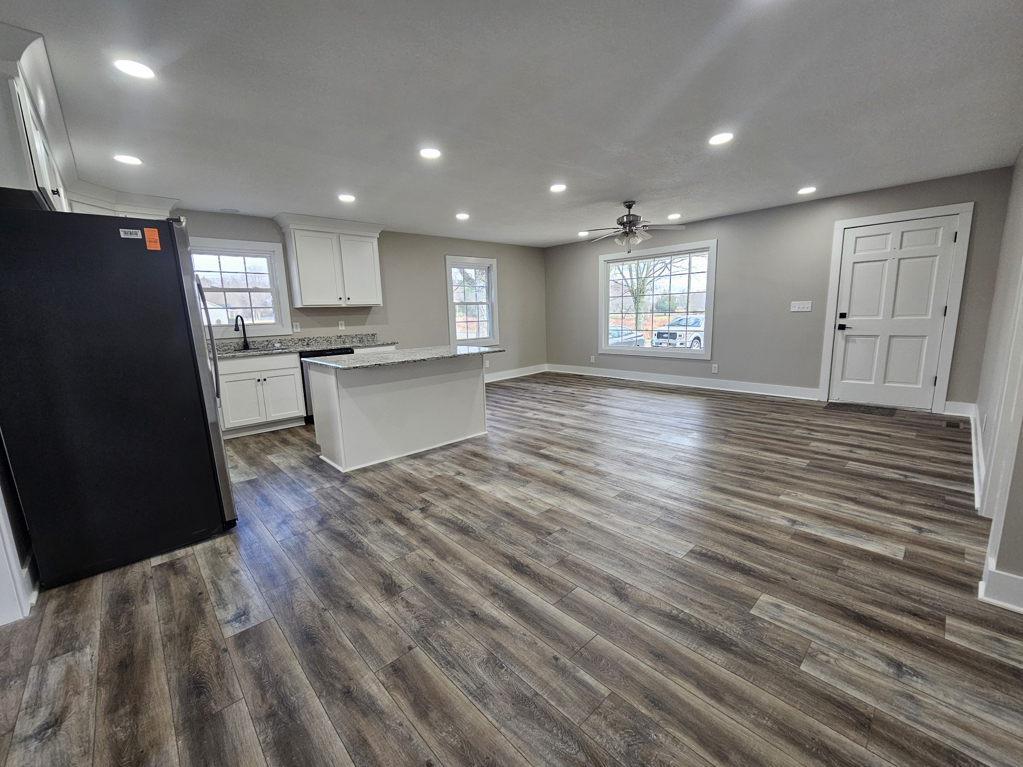 742 Laws Road McMinnville, TN 37110 - Photo 15 of 25 a view of kitchen with refrigerator microwave and wooden floor