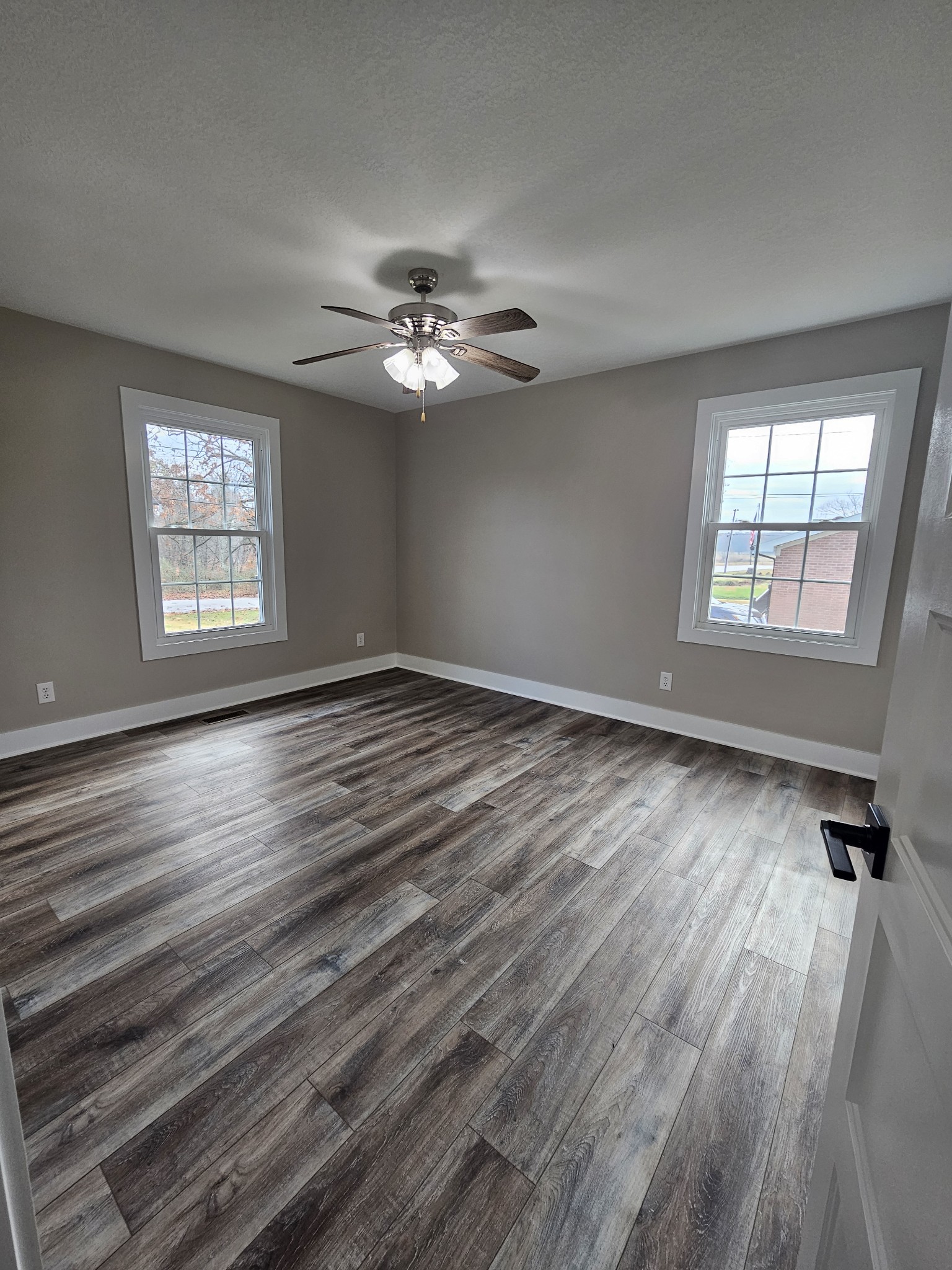 742 Laws Road McMinnville, TN 37110 - Photo 20 of 25 a view of empty room with wooden floor and fan