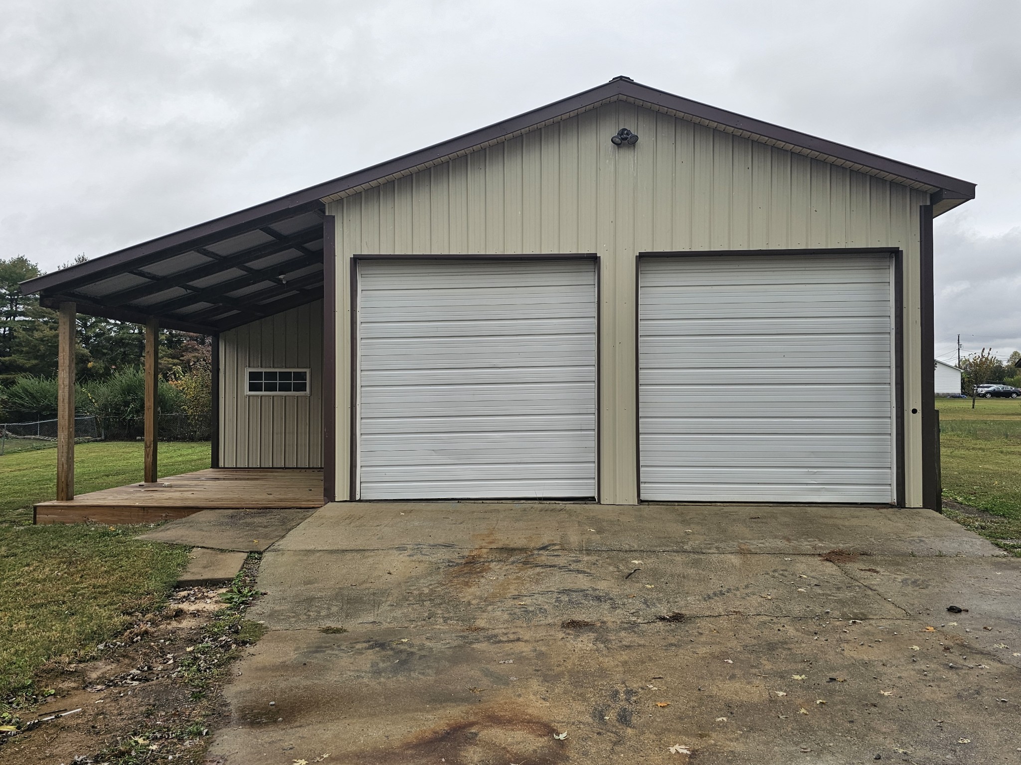 742 Laws Road McMinnville, TN 37110 - Photo 2 of 25 a front view of a house with a yard and garage