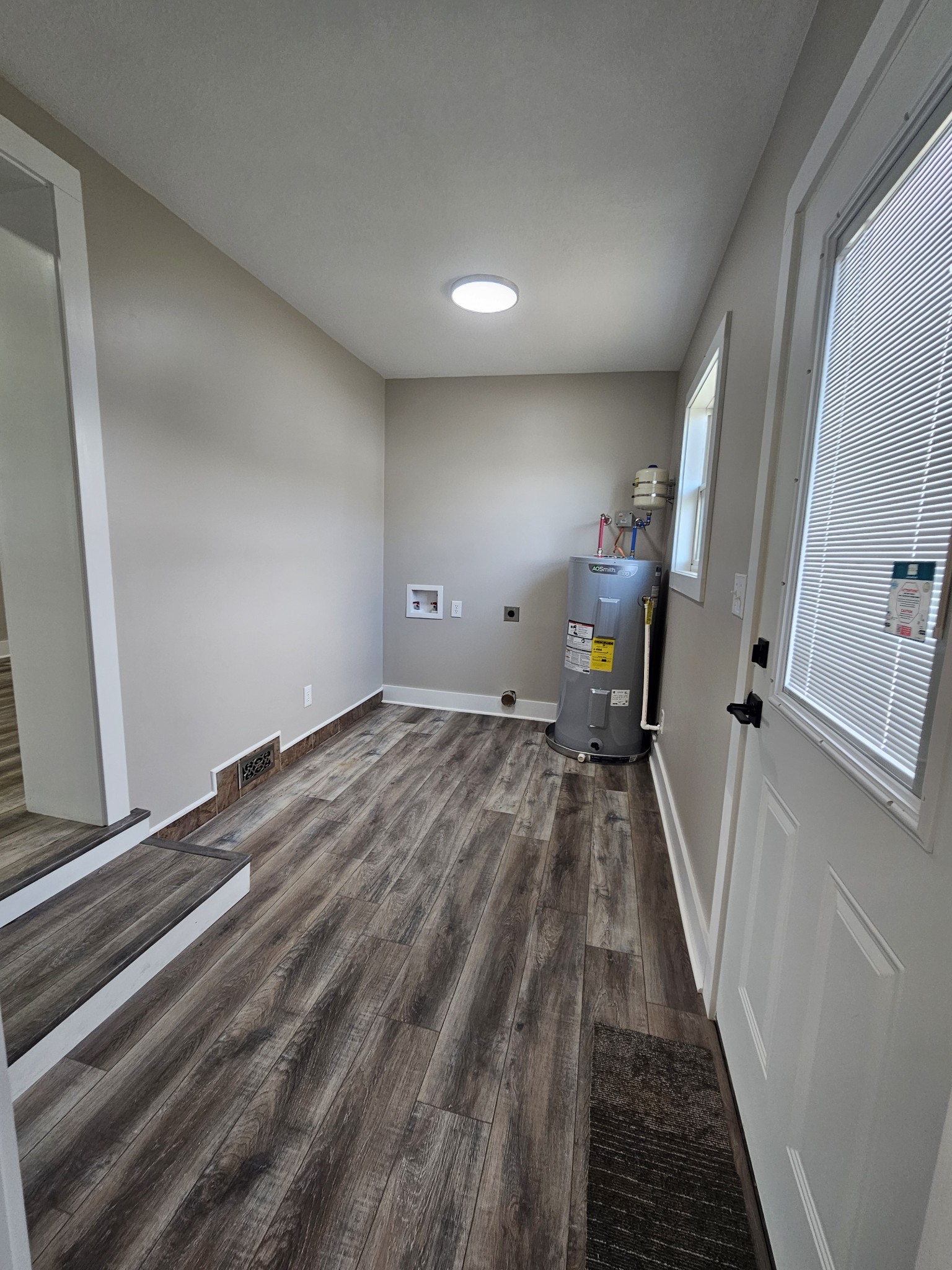742 Laws Road McMinnville, TN 37110 - Photo 24 of 25 a view of a livingroom with wooden floor and stairs
