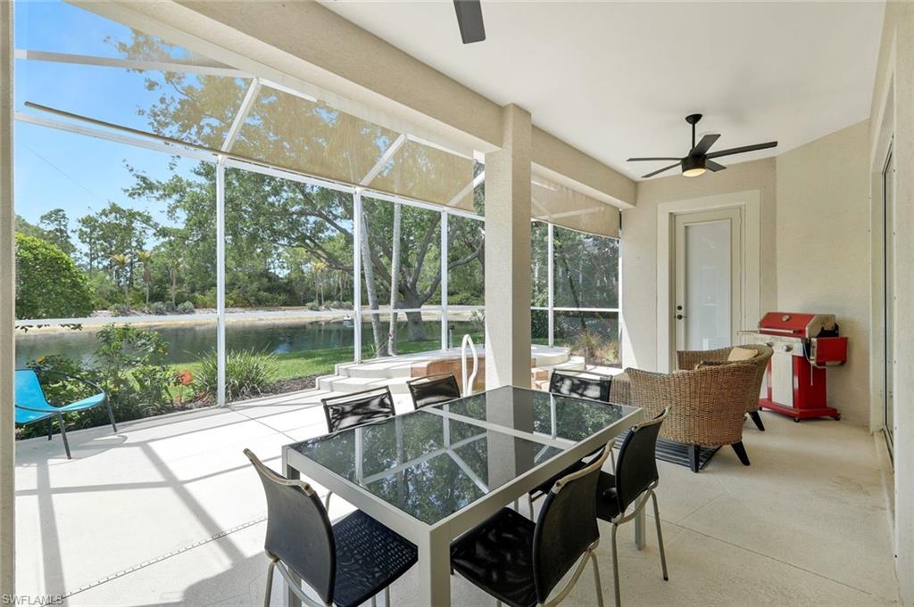 5717 Lago Villaggio Way Naples, FL 34104 - Photo 28 of 35 a dining room with a table and chairs