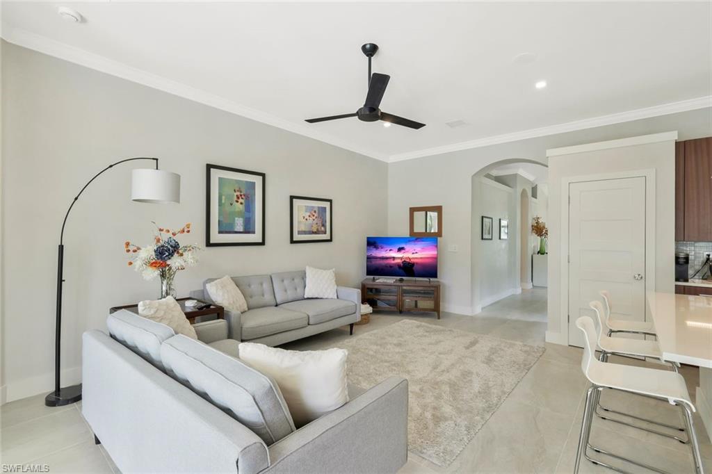 5717 Lago Villaggio Way Naples, FL 34104 - Photo 10 of 35 a living room with furniture