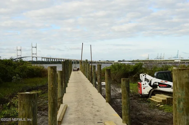 a kitchen with a sink a counter space appliances and a window