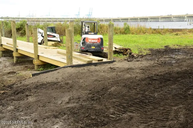 a bathroom with a bathtub and cabinets