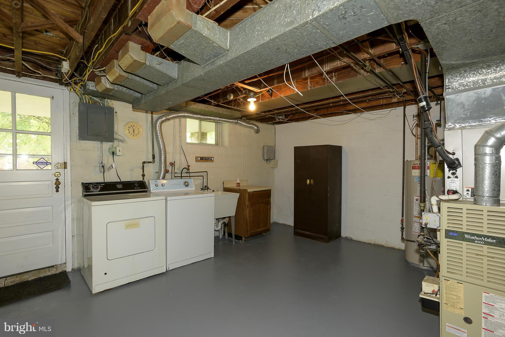 6125 Regent Park Road Catonsville, MD 21228 - Photo 19 of 25 a utility room with cabinets