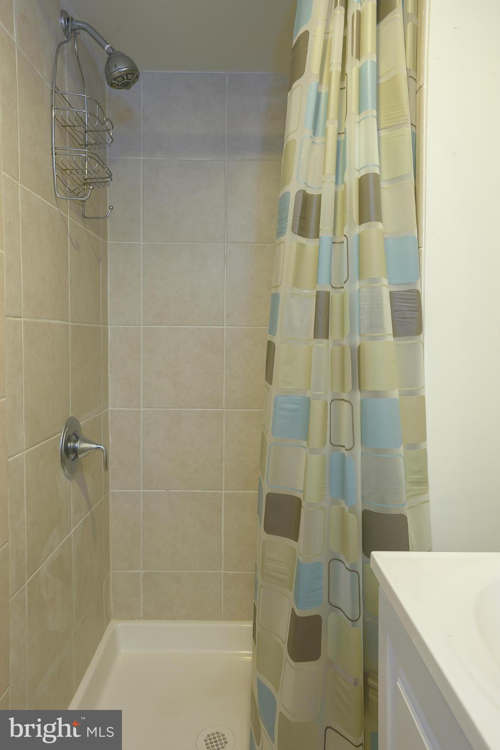 6125 Regent Park Road Catonsville, MD 21228 - Photo 21 of 25 a bathroom with a shower and a sink
