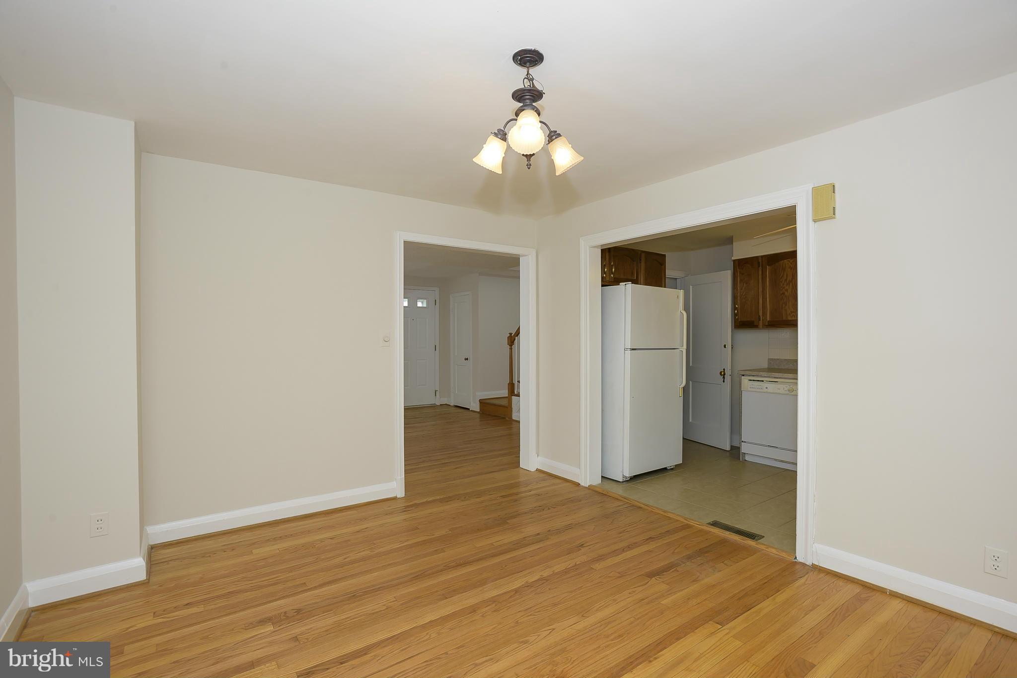 6125 Regent Park Road Catonsville, MD 21228 - Photo 7 of 25 a view of an empty room with wooden floor and closet