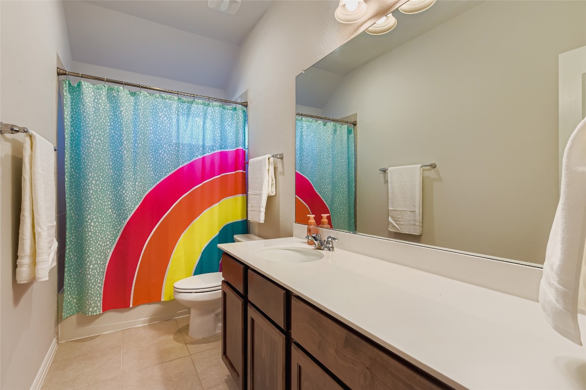 1075 Cherrystone Loop Buda, TX 78610 - Photo 21 of 28 a view of a swimming pool with a bed and a window