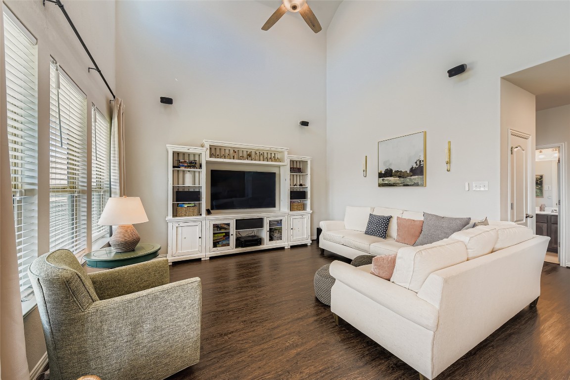 1075 Cherrystone Loop Buda, TX 78610 - Photo 7 of 28 a living room with furniture flat screen tv and a large window