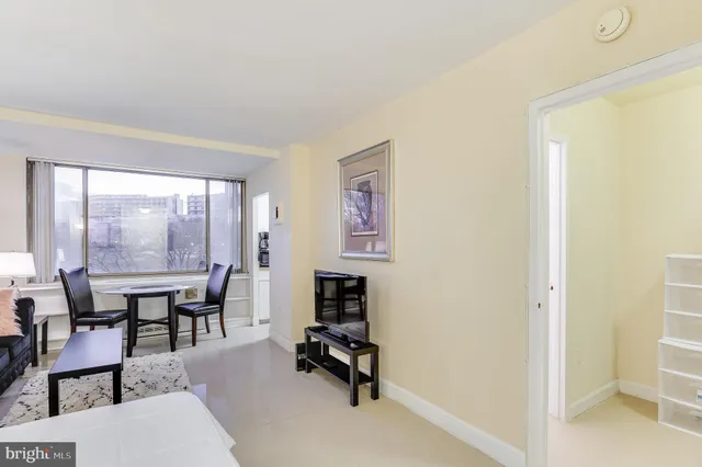 a view of a livingroom with furniture and a window